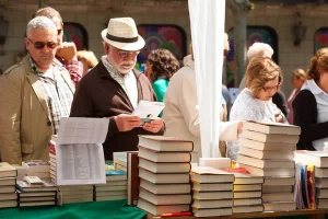 People at the stalls of roses and books in Barcelona, for Saint George Day, celebrated every April 23